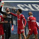 Liverpool’s goalkeeper, Alisson Becker, celebrates scoring his team’s second goal with teammates during the English Premier League football match between West Bromwich Albion and Liverpool.